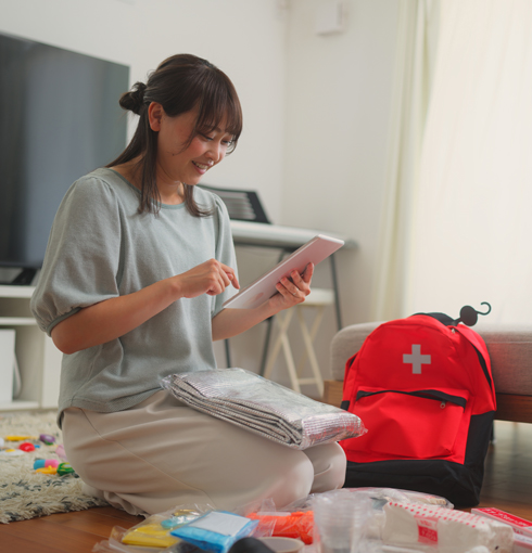 woman-packing-emergency-kit woman-packing-emergency-kit